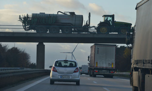 Cars on road against sky