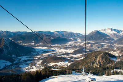 Scenic view of snowcapped mountains against clear sky