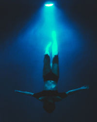 Man and woman in illuminated light