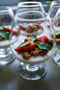 Close-up of strawberries in glass jar on table