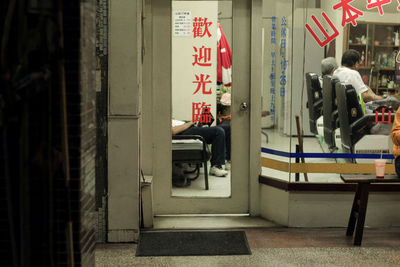 People sitting in front of building