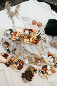 Picnic arrangement on white blanket at rooftop