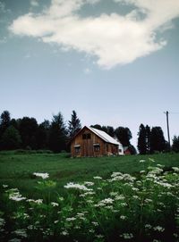 House on field against sky