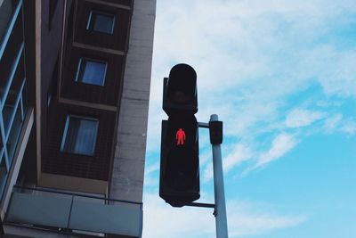 Low angle view of road sign against sky