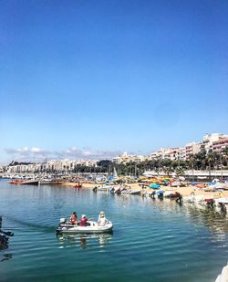 Boats moored at harbor