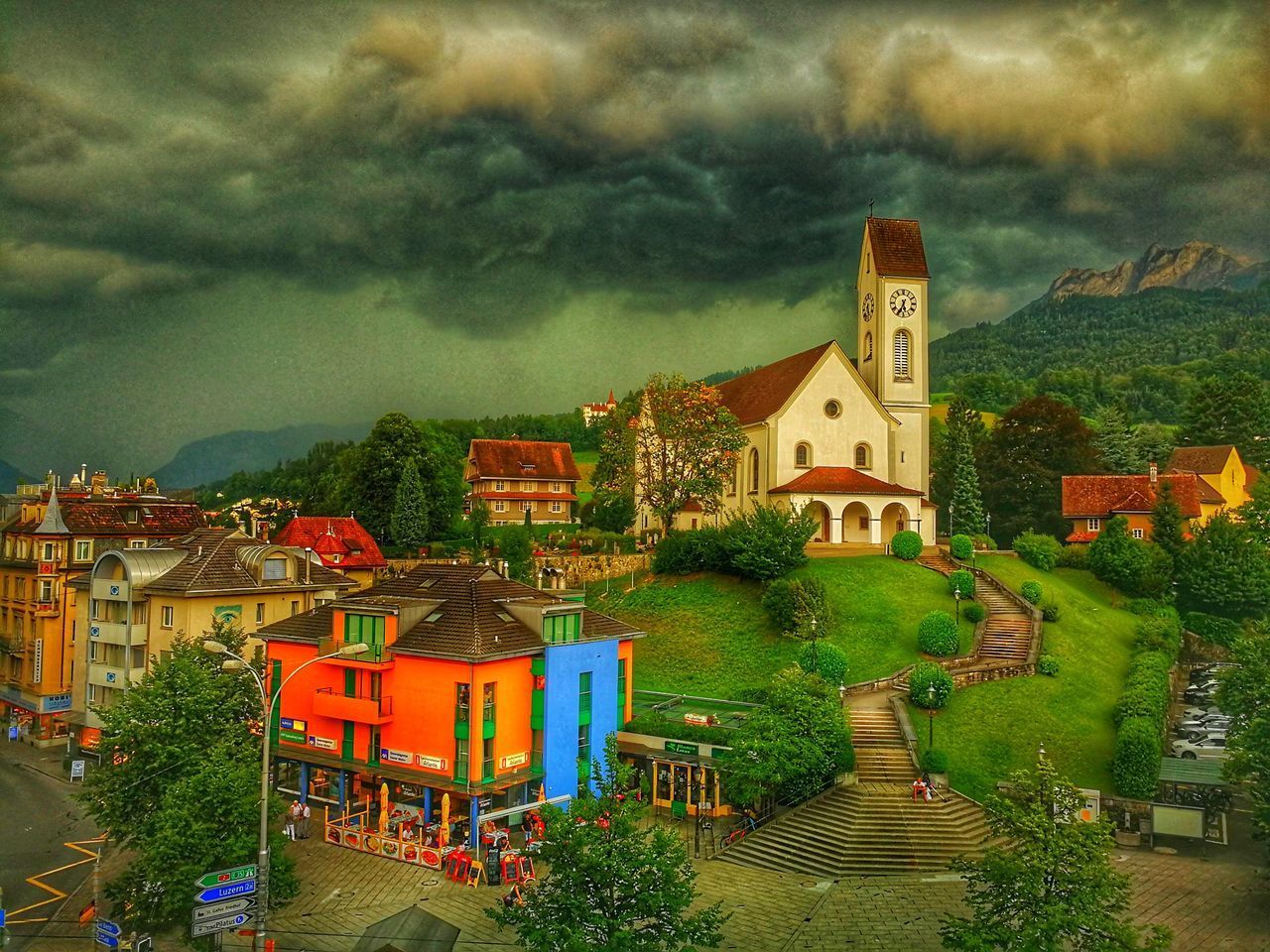 HOUSES AGAINST TREES AND CLOUDS