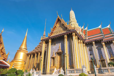 Low angle view of temple building against blue sky