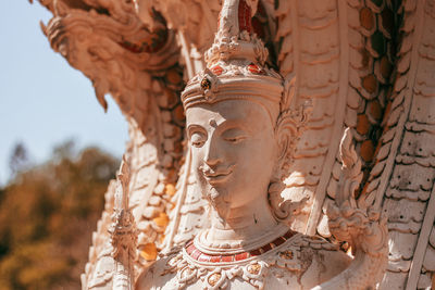 Close-up of statue against building