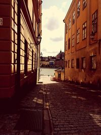 Alley amidst buildings in city