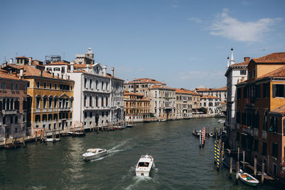 Boats in canal in city