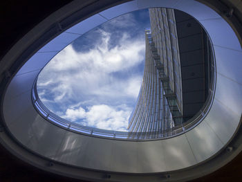 Low angle view of modern building against sky, taken in milan