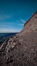 Scenic view of beach against blue sky