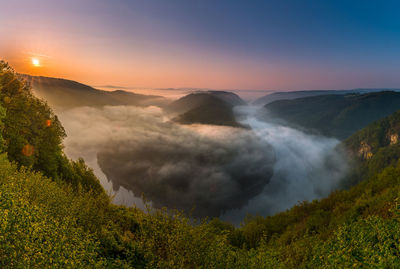 Scenic view of mountains against sky during sunset