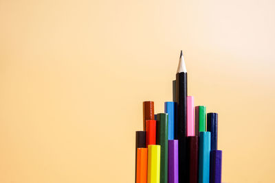 Close-up of colored pencils against white background