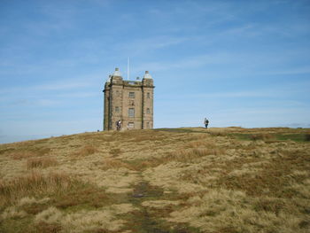 View of lighthouse on landscape against sky