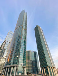 Low angle view of modern buildings against sky