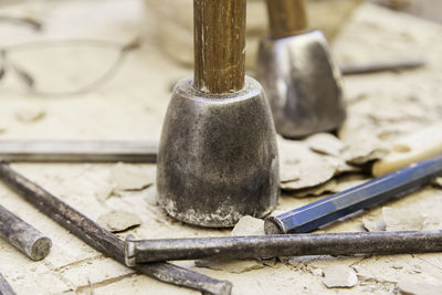 Close-up of tool on damaged rock