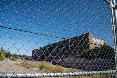 Chainlink fence against blue sky
