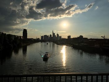 Scenic view of river against sky during sunset