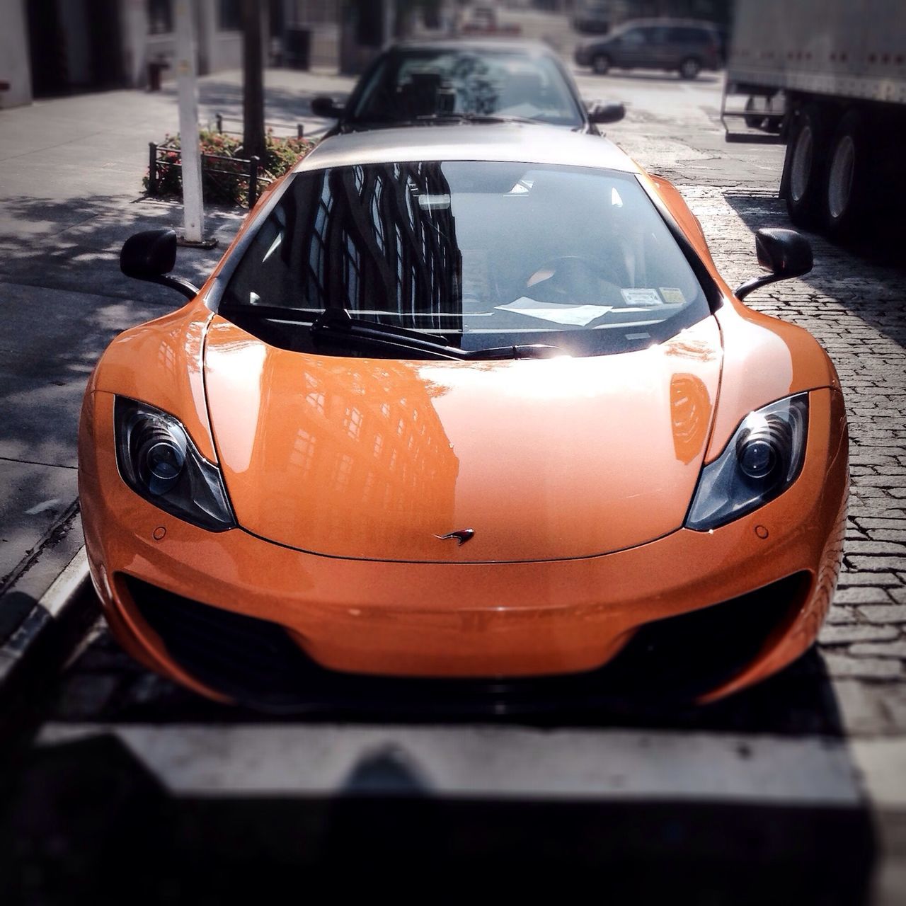 transportation, mode of transport, nautical vessel, moored, boat, land vehicle, focus on foreground, close-up, car, outdoors, water, travel, reflection, street, orange color, no people, sunset, stationary, sunlight, day