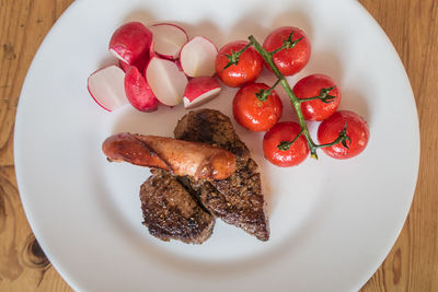 High angle view of berries in plate on table