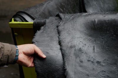 Close-up of man working on metal