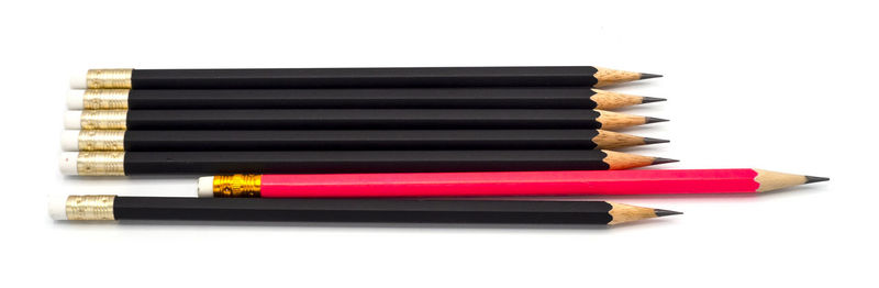 Close-up of colored pencils against white background