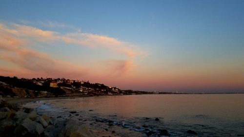 Scenic view of sea against dramatic sky