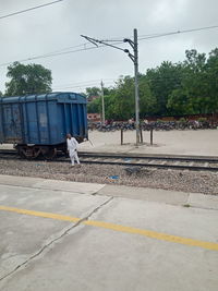 Rear view of man on railroad track