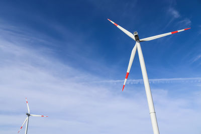 Low angle view of windmill against sky