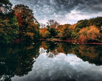 Reflection of trees in lake against sky during autumn