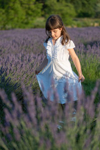 Full length of a girl standing on field