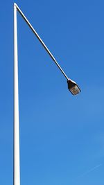 Low angle view of street light against clear blue sky