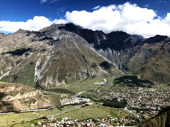 Aerial view of landscape and mountains against sky
