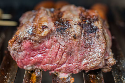 Close-up of meat on barbecue grill