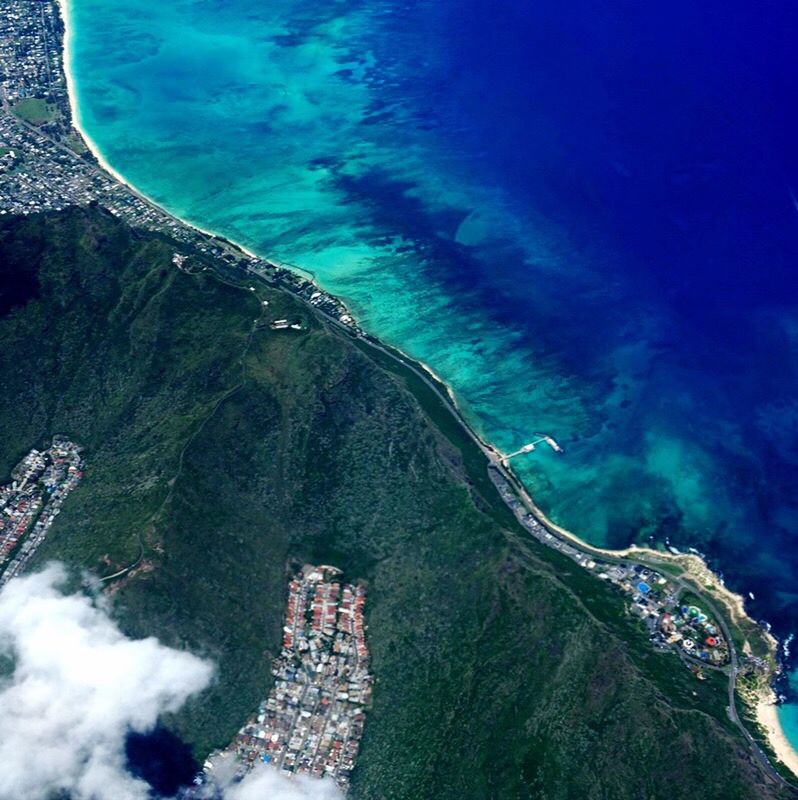 water, high angle view, sea, beauty in nature, aerial view, nature, scenics, day, outdoors, no people, blue, tree, mountain, travel destinations, vacations, wave, sky