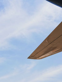 Low angle view of airplane against sky