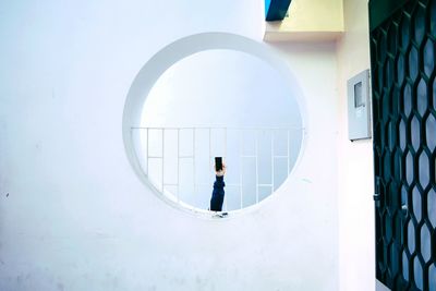 Full length of woman standing on tiled floor