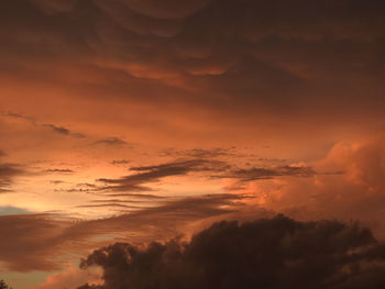 Low angle view of dramatic sky during sunset