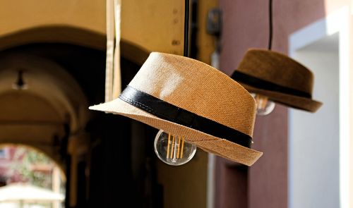 Low angle view of hat hanging on ceiling