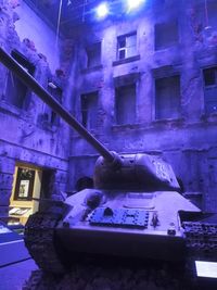 Low angle view of illuminated abandoned building