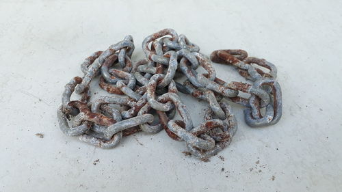 High angle view of rusty chain