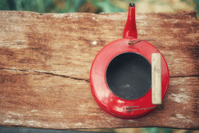 Close-up of red wine on wooden table