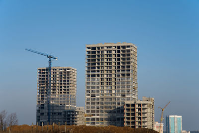 Low angle view of building against blue sky