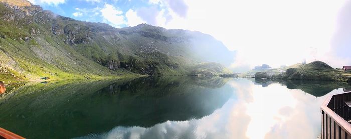 Panoramic view of lake and mountains against sky