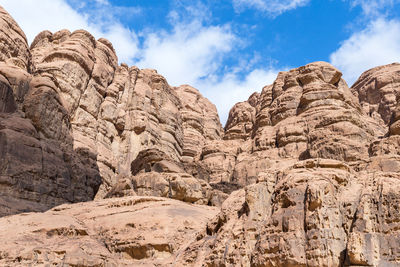 Low angle view of rock formations against sky