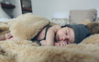 Cute baby sleeping on bed