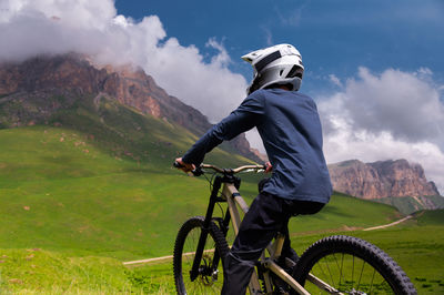 Man riding bicycle on mountain