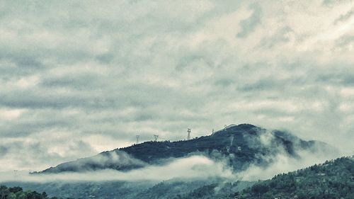 View of clouds over mountain range