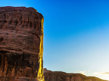 Low angle view of rock formation against sky